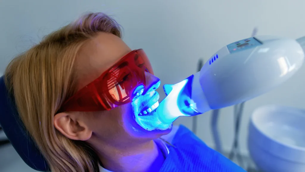 patient getting led teeth whitening in chair bradstowe dental practice