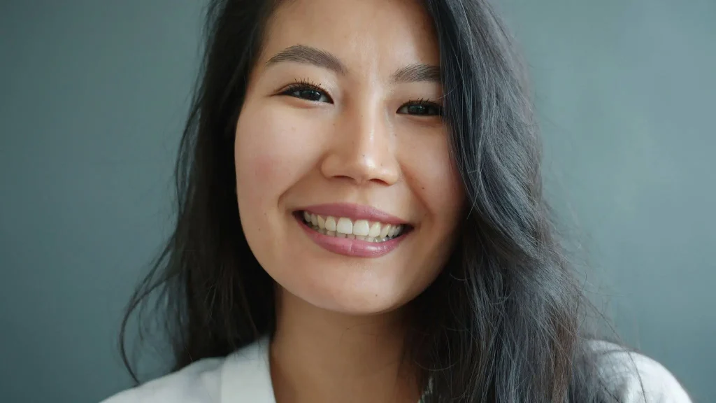 Woman smiling with clean teeth in Surrey