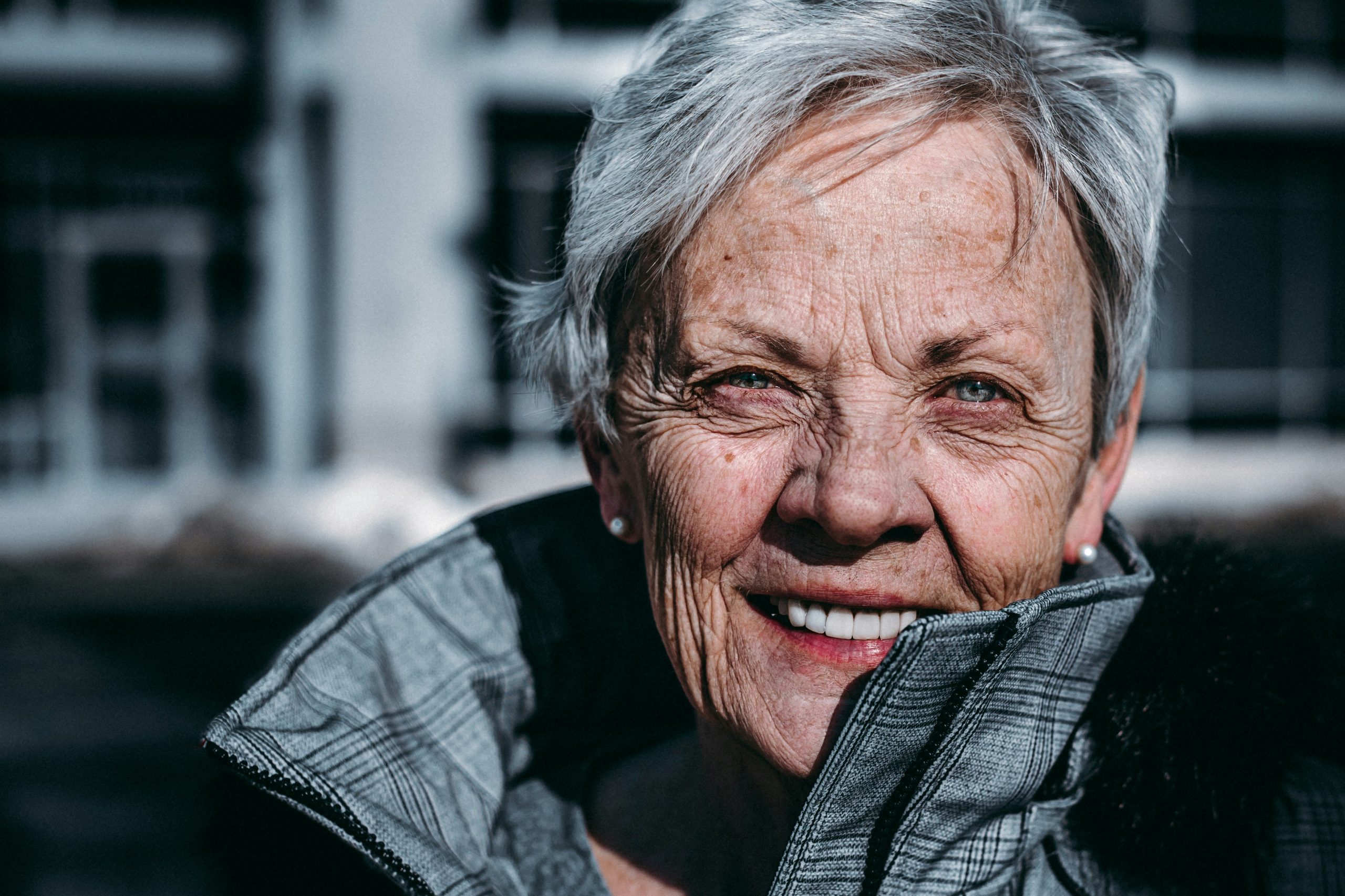 Smiling woman with a confident smile after her dental implant healed fully